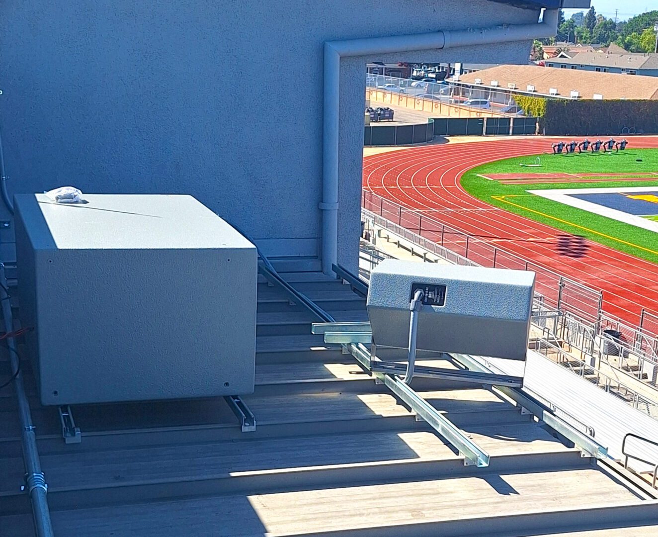 A view of an athletic field from the top of a building.